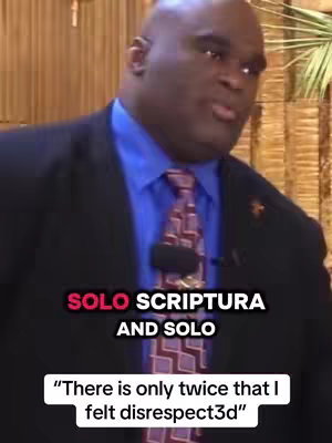A man in a suit is speaking passionately. Text is overlaid on the image.