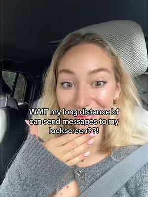 A woman inside a car is looking towards the camera with an expression of surprise and holding her hand up over her mouth, a hook text is overlaid near her left ear with a light-colored background with black text.