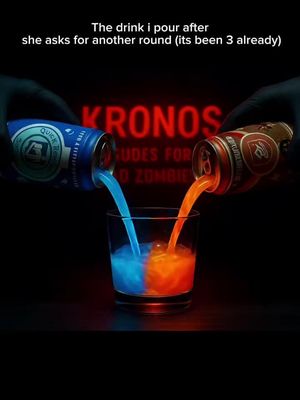A stylized image with a dark background. Two hands, clad in black gloves, are pouring colorful liquids from cans labeled 'Quick Revive' and 'Stamin-Up' into a glass. The liquids form a visually striking blue and orange mix in the glass. Behind the glass, the word 'KRONOS' glows in red. The overall composition is designed to be eye-catching and attention-grabbing.