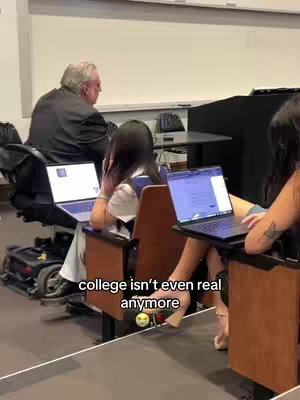 The cover image features a college classroom setting. People are seated in rows of desks with laptops open; the text overlay appears on the laptop screen.
