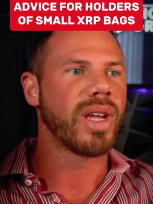 The cover image features a close-up of a man's face. He has short brown hair, a trimmed beard, and blue eyes. He is wearing a red and white striped shirt. Above the man's head is a red banner with white text that reads "ADVICE FOR HOLDERS OF SMALL XRP BAGS". The background is dark, and the man appears to be in an indoor setting, possibly a studio.