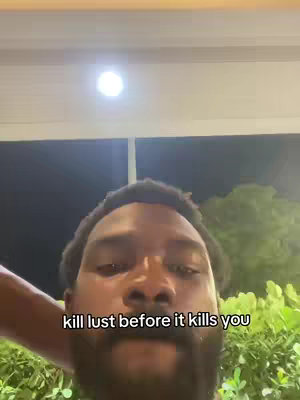 The cover image features a close-up view of a Black man's face, centered in the frame. The background is dark, possibly nighttime, with visible foliage on the right side and a bright, circular light source above. The hook text is written in a white, simple font and appears below the man's face.