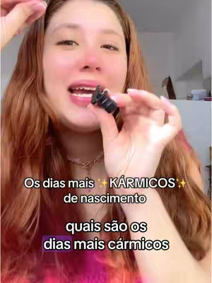 A woman with long auburn hair is holding a small object to her mouth, looking toward the camera. Text overlays on the image.