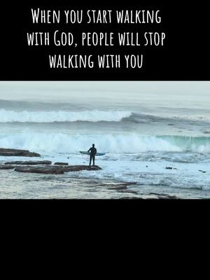 The image depicts a serene scene of a person standing on a rock in the ocean with a surfboard, facing the waves. Large waves are crashing in the background under a cloudy sky with the top part of the image being a black shape containing white text.