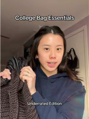 The cover image shows a young woman in a navy blue hoodie, holding a dark brown, textured item. She is facing the camera and smiling, with text overlayed on the cover. The background suggests an indoor setting.