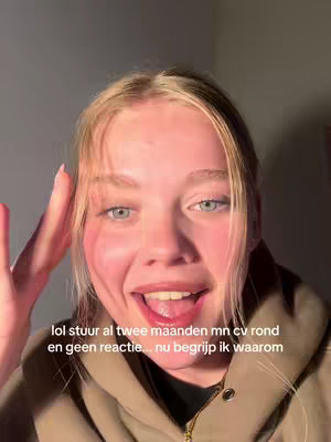 A young woman with blonde hair is shown in a close-up, angled shot, smiling and looking directly at the camera. Her expression is open-mouthed, suggesting laughter or surprise. overlaid text is on the image, likely to grab attention.