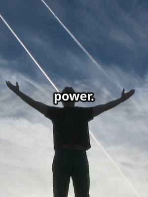 A silhouette of a man standing with his arms wide open against a partly cloudy blue sky. Two parallel white trails streak diagonally across the sky. The text 'power.' is overlaid at the man's chest level.