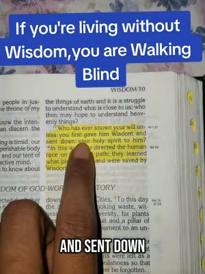 The cover image shows an open book, likely a Bible, with a finger pointing at a highlighted passage. Overlaid at the top is a blue bar containing the text, 'If you're living without Wisdom, you are Walking Blind'. Below that is the sentence 'AND SENT DOWN' from what appears to be part of a sentence in the Bible highlighted in yellow. The overall composition frames a religious message.