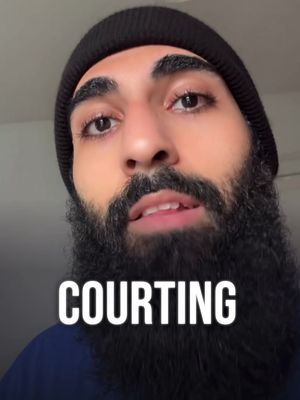 A close-up shot of a man with a black beanie and a long, dark beard. The word 'COURTING' is overlaid in bold white text at the bottom of the frame.
