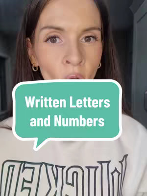 A woman looks directly at the camera with a speech bubble overlay. The speech bubble contains the text 'Written Letters and Numbers'. The woman has brown hair and is wearing a white sweatshirt.