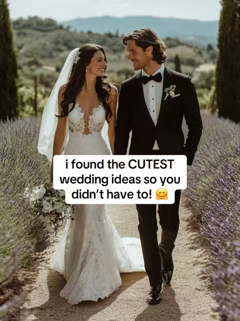 A couple in wedding attire walks hand in hand on a path in a garden, smiling at each other. Above them is a text overlay.