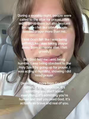 The cover image shows a close-up of a woman inside a car, captured from the chest up. She has brown hair and is looking slightly downwards, and is wearing a white shirt and a seatbelt which is prominent. Text overlays appear in the image and convey personal reflections within a spiritual context.