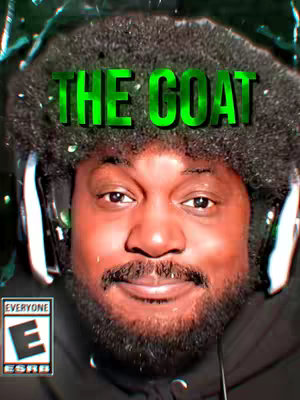 The cover image features a medium close-up of a man's face, likely a selfie. He has a dark complexion, a black beard, and is wearing a black top. His hair is styled in a shaggy afro with visible headphones. "THE GOAT" is prominently displayed in a glowing green, stylized font overlaid above the man's head. The background suggests a blurred, possibly digital, effect. The overall composition uses a limited, dark color palette with a noticeable green highlight.