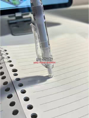 The cover image shows a close-up view of a white pen resting on a spiral notebook. The pen is transparent, and the tip is touching the lined paper, with a shadow cast beneath. The notebook has hole-punched edges. The hook text is overlaid, indicating the image's theme.