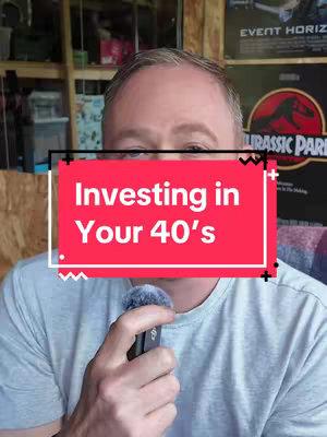 A medium shot showing a man's face, centered with the words 'Investing in Your 40's' overlaid on a red background. He is holding a microphone. The background is a room with wood paneling and posters.
