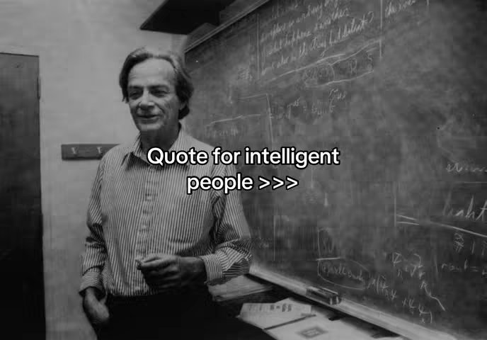 A black and white photo shows a man standing next to a chalkboard filled with equations. He's wearing a striped shirt and looking towards the camera, with text overlayed.