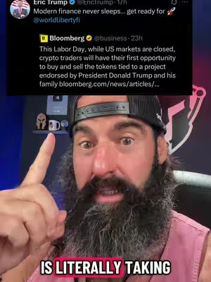 A man with a beard and a black hat points upwards with his index finger. Behind him is a screen with a Twitter post about President Trump and his family and their crypto currency.