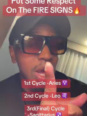 A selfie-style shot featuring a Black man wearing a black hat and sunglasses, looking towards the camera. The background is out of focus with what appears to be a white curtain. Overlayed text in a red box reads 'PUT SOME RESPECT ON THE FIRE SIGNS', with additional text below detailing zodiac cycles and signs.