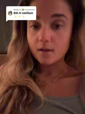 A medium shot of a woman with wavy, light-brown hair looking towards the camera. A comment overlay is in the upper-left corner.