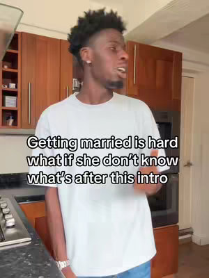 A man in a white t-shirt stands in front of a kitchen with dark wooden cabinets. Text overlaid on the image reads, 'Getting married is hard what if she don't know what's after this intro.'