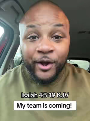 The cover image showcases a close-up of a man in a car, likely filming a selfie video. He has a bald head, a beard, and is wearing a green t-shirt. Text overlays read "Isaiah 43:19 KJV" and "My team is coming!". The background suggests an interior car setting.