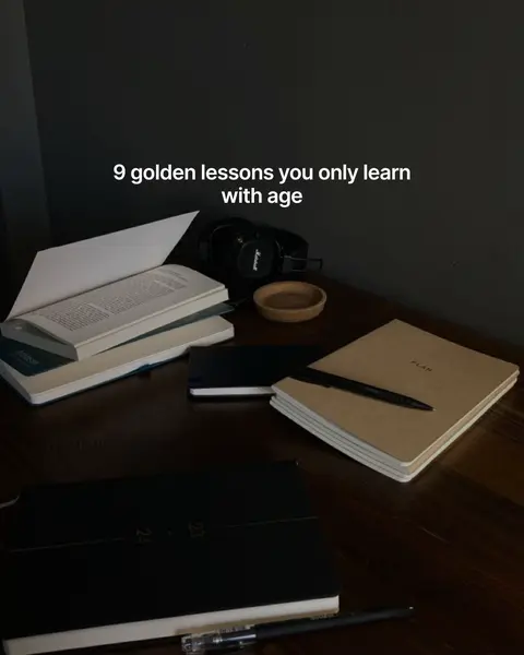 A dimly lit image of a desk with various items indicating a focus on learning and productivity. Several notebooks and a book are stacked on the desk. A black pen lays and headphones and a small wooden bowl are also visible. The text overlay reads '9 golden lessons you only learn with age'. The overall aesthetic is dark and moody.