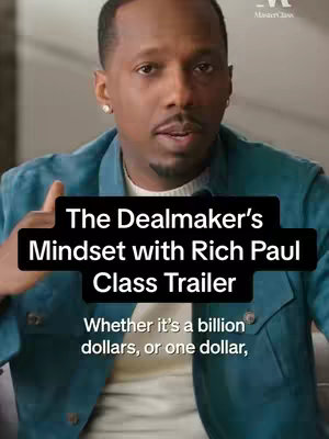The cover image features a man in a close-up shot, centered and slightly above the frame. He wears a blue jacket over a white shirt, with a subtle earring visible. The background is blurred, focusing attention on him. Overlaid on the image are two black rectangular text boxes: the first displays the title 'The Dealmaker's Mindset with Rich Paul Class Trailer' and the second contains the text 'Whether it's a billion dollars, or one dollar'. The MasterClass logo is visible in the top right corner.