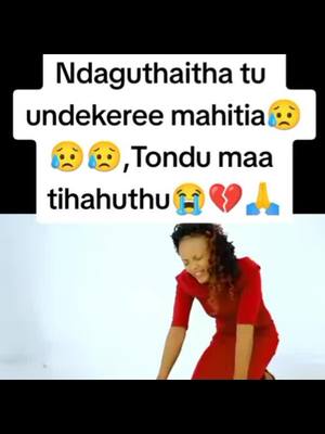 The cover image shows a woman kneeling and crying in a studio-like setting. The background is plain. A white rectangular element with text overlays the upper section of the image. The woman is dressed in a red dress.