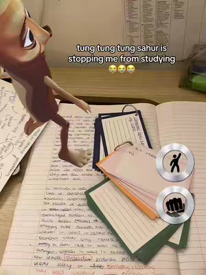 A digital animation of a cartoon character is on the left side of the image, with its legs on the left page of an open notebook filled with handwritten notes. There are flashcards on the page, along with the text overlay in the top area. Silver icons are in the bottom-right corner.