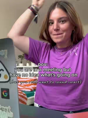 A woman with long brown hair is in a room. She's wearing a purple shirt. There is text overlay on the image.
