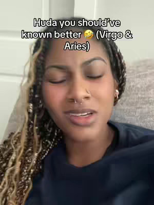 A close-up shot of a woman with braided hair, a nose ring, and a black top. Text overlay is present at the top of the image.