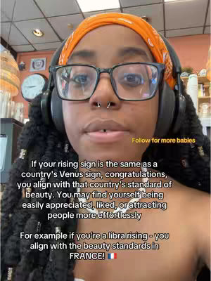 A selfie of a Black woman with dark curly hair, glasses, and an orange headscarf, wearing headphones. Text overlays are visible, and the background is a blurry indoor setting. The overall tone is educational and direct.