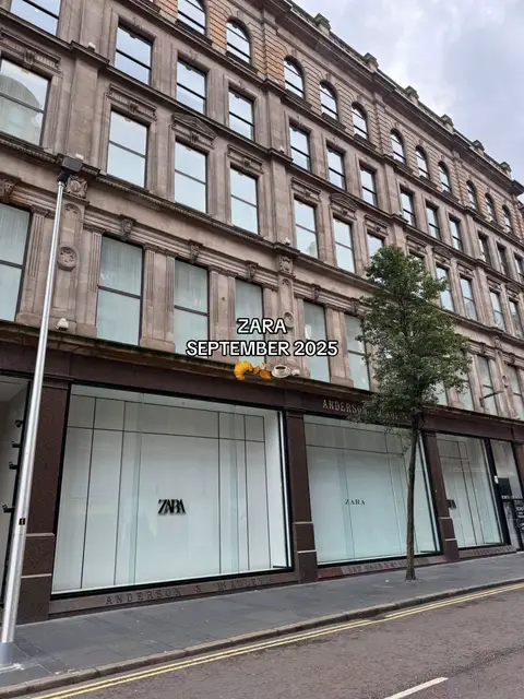 The cover image shows the exterior of a Zara store on a city street. The building has multiple floors, with large windows. The Zara logo is visible on the storefront. The sky is overcast.