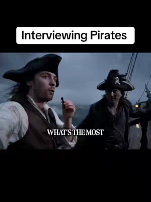 The image shows two men dressed as pirates on a ship. The man on the left is holding a microphone and looking directly at the camera, appearing to be speaking. The man on the right is in the background, also in pirate attire. The top of the image has the text overlayed as 'Interviewing Pirates' in a white rectangular container