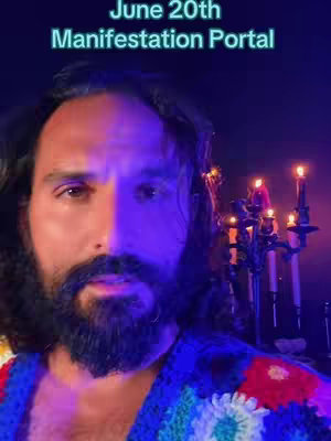 The cover image features a man with dark hair and a beard, split in half visually by a change in lighting. The left side of his face is brightly lit, while the right side is dark. The text overlay reads 'June 20th Manifestation Portal'. In the background are candles in a candelabra under a dark background.