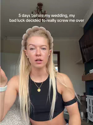A blonde woman with a neutral expression sits in front of a blurred background. She wears a black top, a headband, and a necklace. Text overlay at the top says "5 days before my wedding, my bad luck decided to really screw me over."