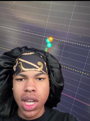 A selfie-style image featuring a young person wearing a black durag with a gold pattern, set against a data visualization background. The person is looking directly at the camera with their mouth open, seemingly talking. The background displays a dark grid overlaid with colored data points suggesting market trends.