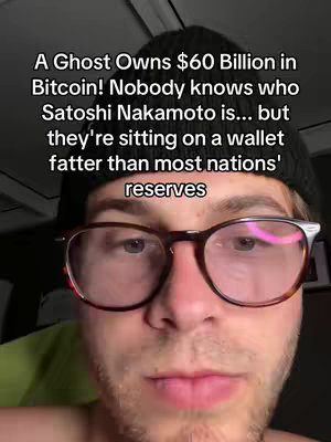 A selfie-style video cover, showcasing a close-up of a man wearing glasses and a beanie. The background is blurred, with text overlaying the top which says: 'A Ghost Owns $60 Billion in Bitcoin! Nobody knows who Satoshi Nakamoto is... but they're sitting on a wallet fatter than most nations' reserves.'