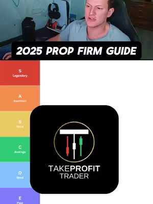 The image is a vertical composition. At the top, a man with light skin and short, light-brown hair, is seated, looking toward the camera. He is wearing a gray t-shirt and is set in what appears to be a home office, behind a dark chair. Below the image of the man is a black rectangle with white text reading "2025 PROP FIRM GUIDE". The bottom portion of the image features a colored tier list, the left features a list of tiers labeled S, A, B, C, D, and E. The tier list ranks the Take Profit Trader logo in a black rounded rectangle with the Take Profit Trader logo in the center. The logo shows three lines that appear vertically, of red, white, and green, in front of a gold-outlined box and the words Take Profit Trader. 