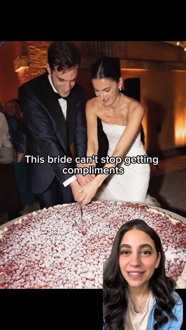 The cover image shows a split screen. The top half captures a couple cutting a large cake, the man in a dark suit and the woman in a white dress. The cake is covered in red fruit. The bottom half shows a woman in a denim jacket smiling. The text overlay reads 'This bride can't stop getting compliments'.