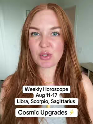 A woman with long auburn hair and pale skin directly faces the camera, positioned closely in the frame. She has light eyes and is wearing minimal makeup, with noticeable lip gloss. The background is blurred, suggesting an indoor setting with neutral color tones.  Text overlays with a dark background are positioned across the center of the video, and an eye catching electric bolt is at the end. The overall composition is bright and well-lit.