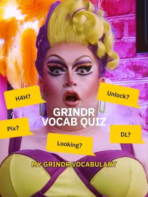 The image is a selfie-style shot featuring a person dressed in drag, with vibrant makeup and hair. The background is blurred and brightly lit with pink and yellow hues, while multiple text boxes surround the person, each containing a slang term or inquiry. The central text reads Grindr Vocab Quiz, conveying the video's topic.