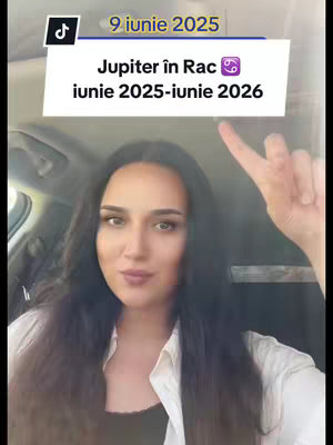 A woman with long dark hair is centered in a car. She is pointing towards the top of the view where a white text box shows information about Jupiter in Cancer. The woman is wearing a light-colored top. The TikTok logo is visible.