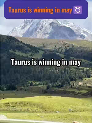 The image features a natural landscape with a mix of green hills, a forest, and a mountain range in the background. Text overlays are added, including a purple rectangle at the top with white text reading "Taurus is winning in may" and the Taurus zodiac symbol. Below that, on the background the same text appears.