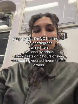 A selfie-style shot from the chest up, featuring a person with dark hair and a neutral expression set against a plain background. The person faces the camera directly. overlaid text is positioned in the middle of the screen and lists several items.