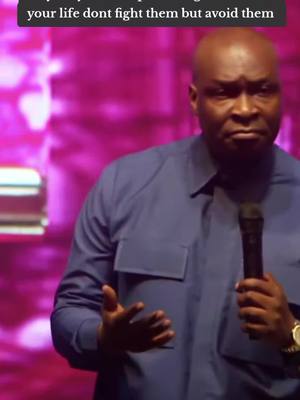 The cover image shows a man in a blue shirt standing and speaking into a microphone. The background is a blurry gradient of pink and purple.