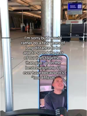 A selfie is taken from inside a phone case. The phone is held up, reflecting the face of a young woman. She appears to be in an airport terminal. The phone case is blue and the background is a soft gray. The woman’s reflection shows her with a slightly open mouth, as if in anticipation, and looking upward. The text overlay is a lengthy message in white.
