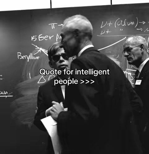 A black and white image features three men in suits standing in front of a chalkboard with scientific diagrams and equations. The man in the center is wearing sunglasses and holding a white paper. Text overlayed on the image states 'Quote for intelligent people >>>'.