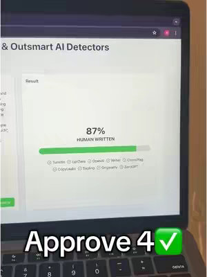 A laptop screen displays a webpage analyzing text for AI detection with the result showing "87% HUMAN WRITTEN" and also an overlay of the text "Approve 4 ✓" at the bottom, with the keyboard partially visible.