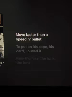 The image displays song lyrics against a dark background. It shows text overlaid, likely representing song lyrics, in a simple white font. Sections of the lyrics are highlighted with a more prominent font. The aesthetic is minimalistic, with primary focus on the lyrics.